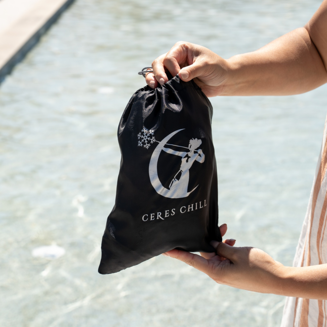 A woman holding Ceres Chill Wash Basin bag. 