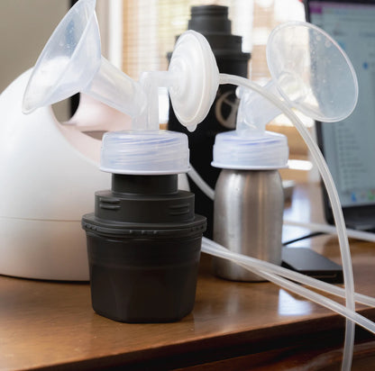 Ceres Chill cup and 6oz inner chamber with breast pump attachments connected sitting on a table. 