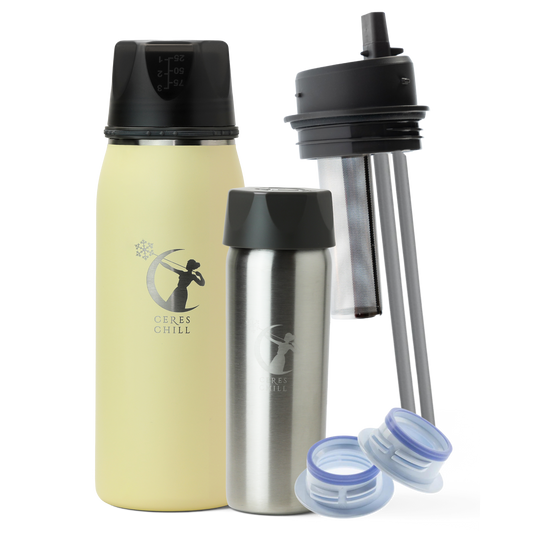 Collection of items including a Yellow OG+ breast milk insulated storage chiller, inner chamber, tea infuser, and breast pump attachments on a white background